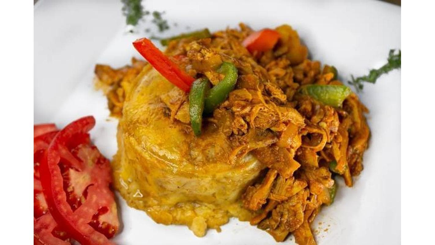Stewed Chicken (Mofongo con Pollo Guisado ) at El Caldero Restaurant